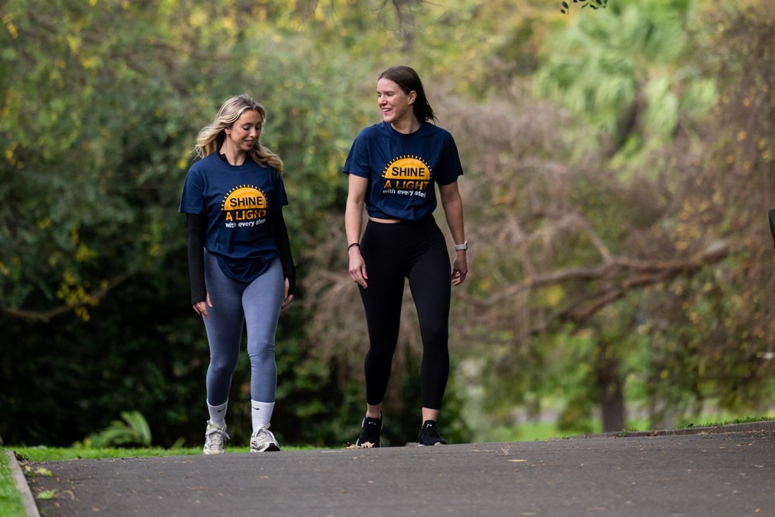 Two volunteers in the park.