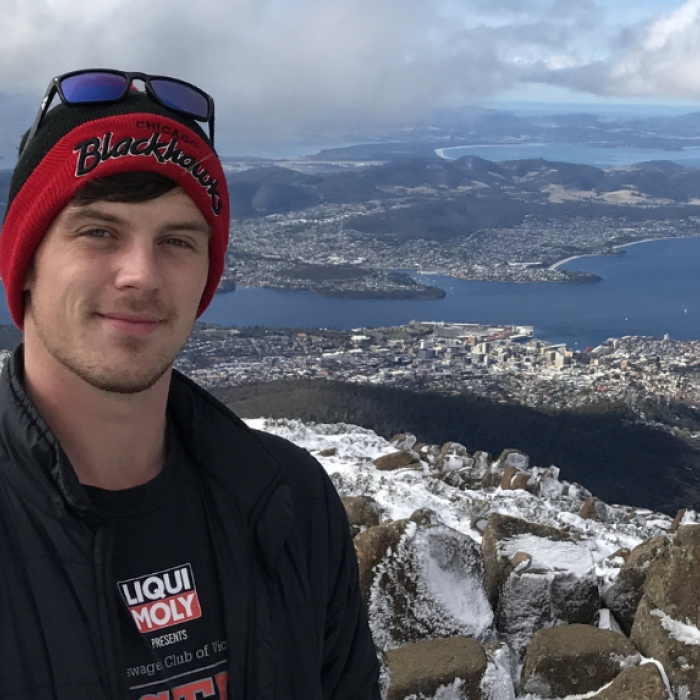 Will standing infront of oceanside view