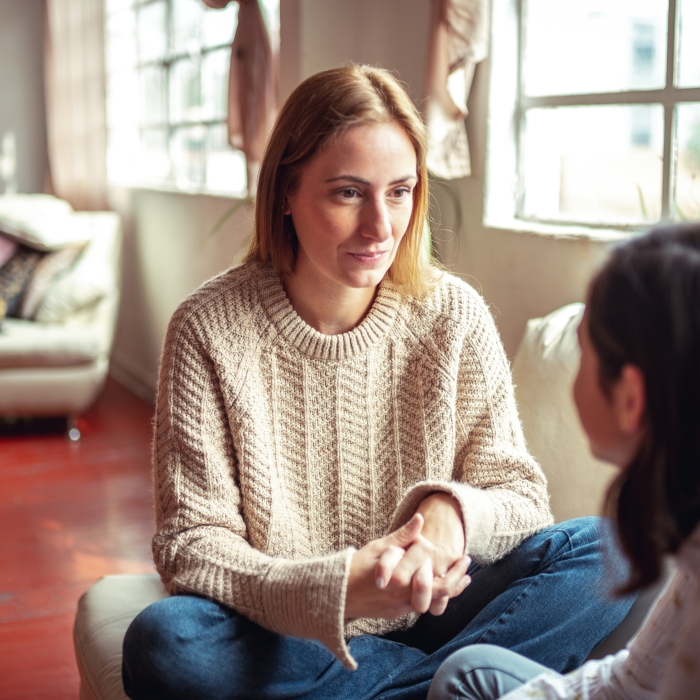 Woman talking to a young person