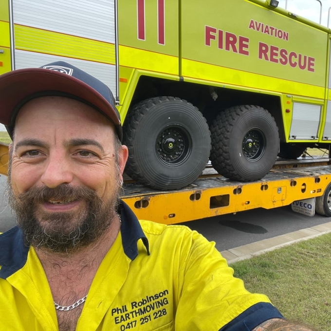 man standing in front of fire rescue truck