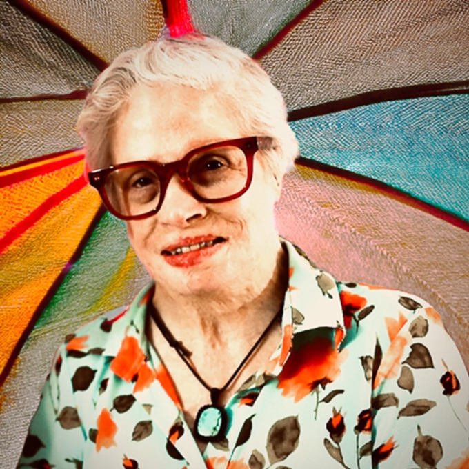 portrait of woman wearing glasses and floral shirt
